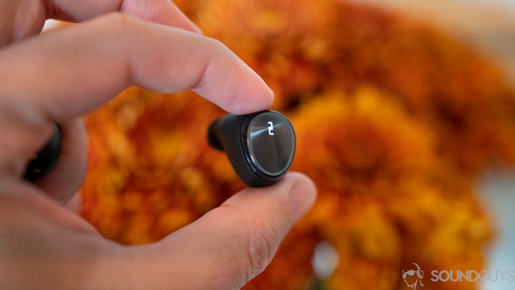 Optoma Be Free6 single earbud in hand