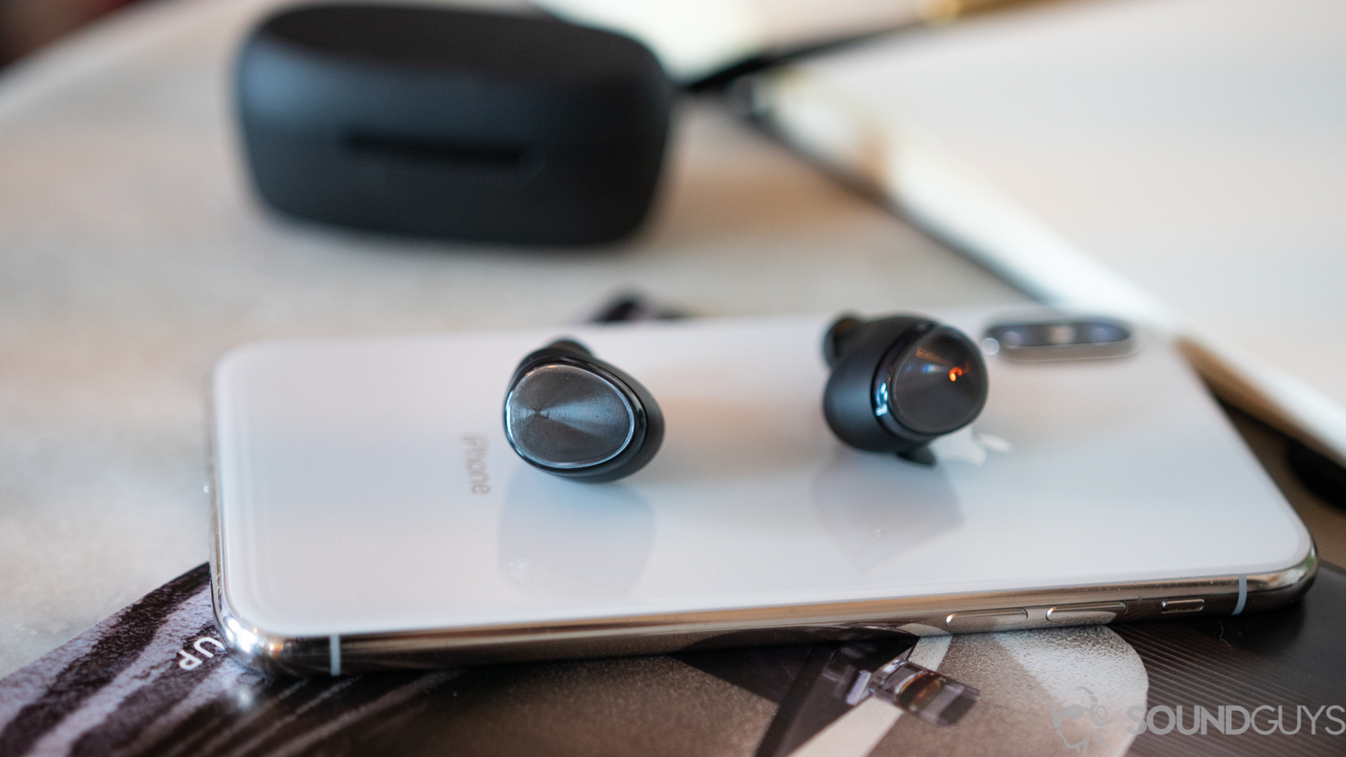 Optoma Be Free6 earbuds on iPhone X