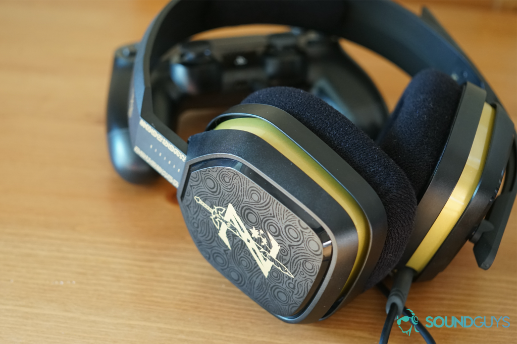 The Legend of Zelda Breath of the Wild Astro A10 gaming headset leans on a Playstation 4 dualshock controller.