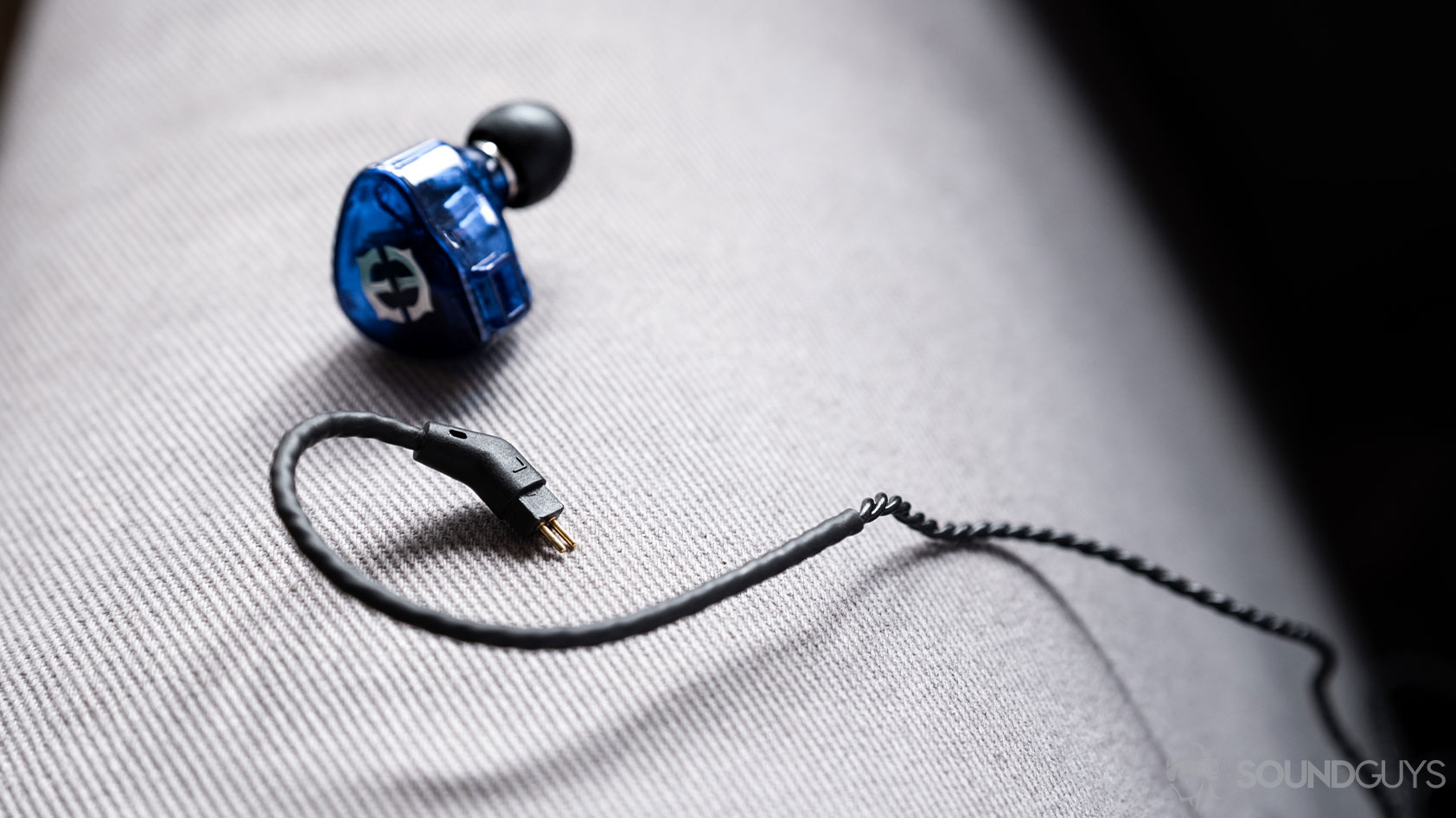 A close-up photo of the Massdrop x Empire Ears Zeus earbuds removable 2-pin cable.