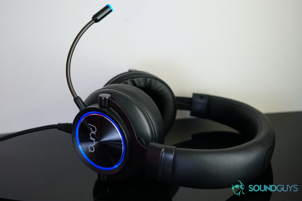 The Puro Sound Labs PuroGamer headset lies on its back on a black surface