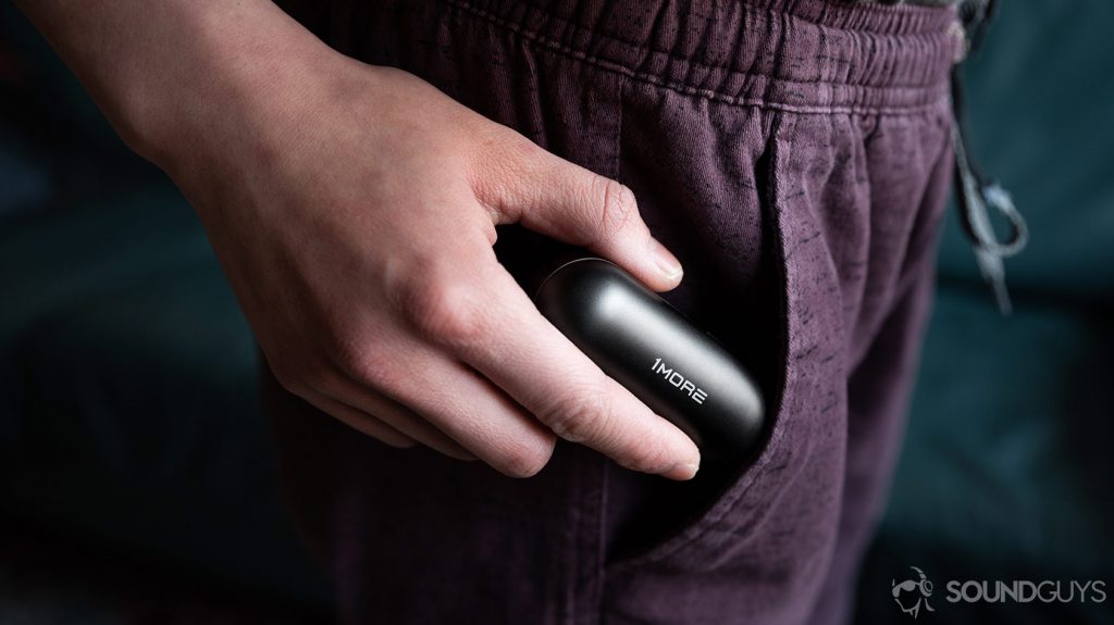 The 1More True Wireless ANC charging case being pocketed.