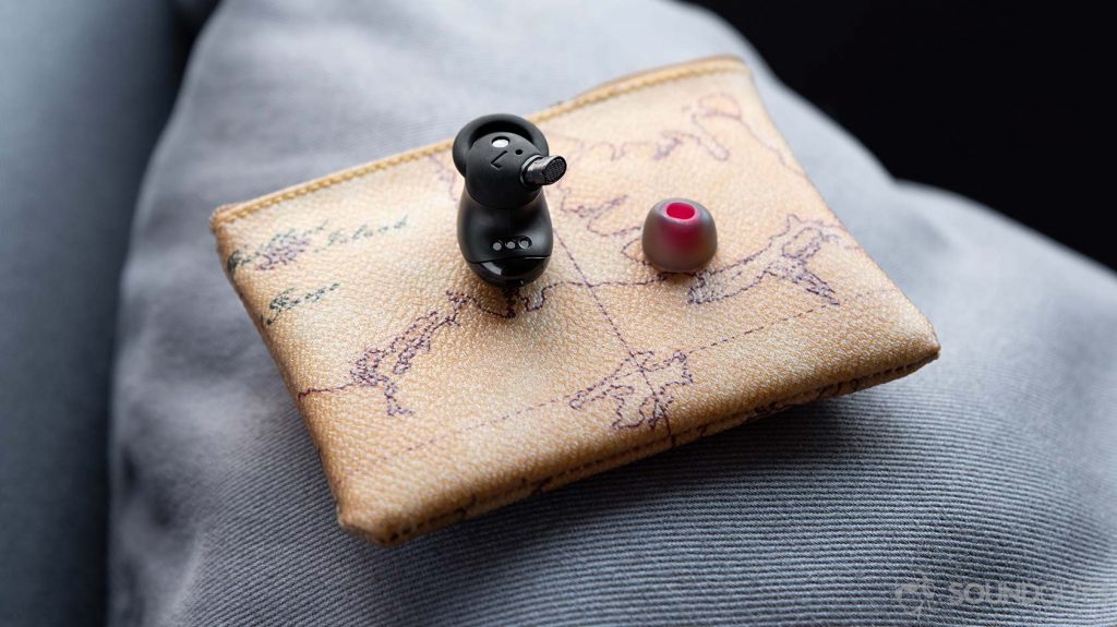 The 1More True Wireless ANC earbud nozzle with a red ear tip next to it.