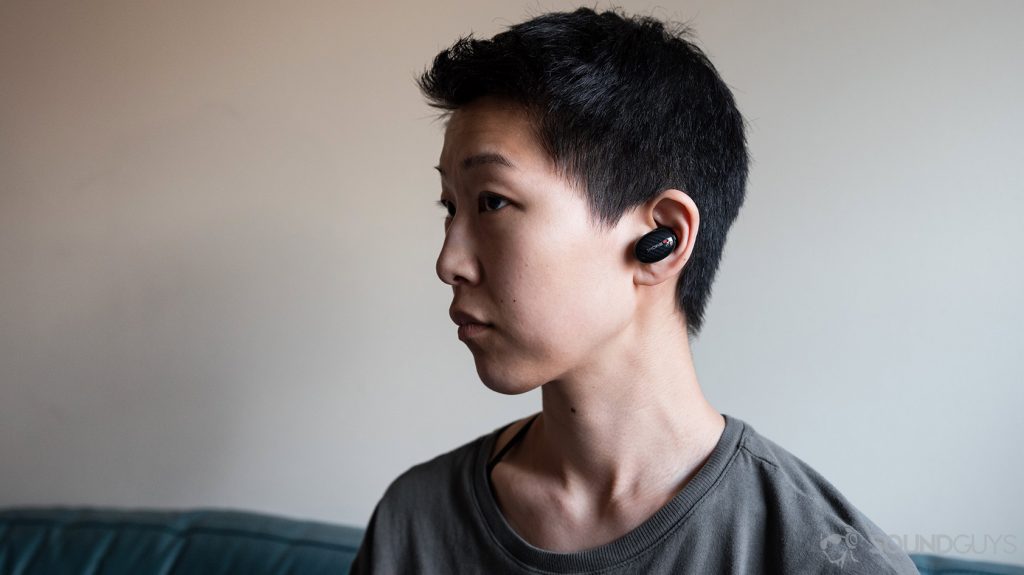 A woman wears the 1MORE True Wireless ANC.