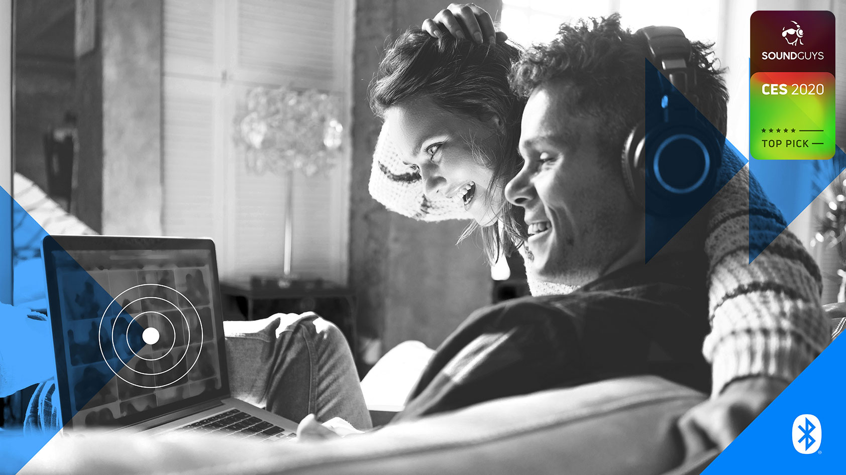 A manufacturer's photo of a man and a woman listening to headphones in front of a computer, with the Bluetooth logo in the corner.