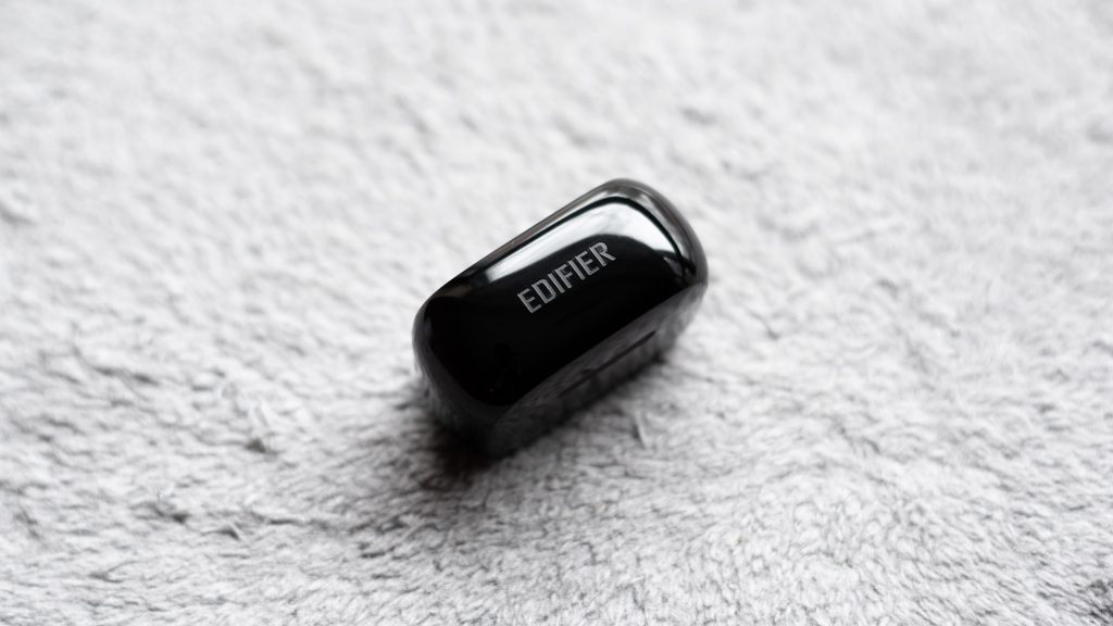 A photo of the Edifier TWS1 true wireless earbuds' charging case with the Edifier logo in focus.