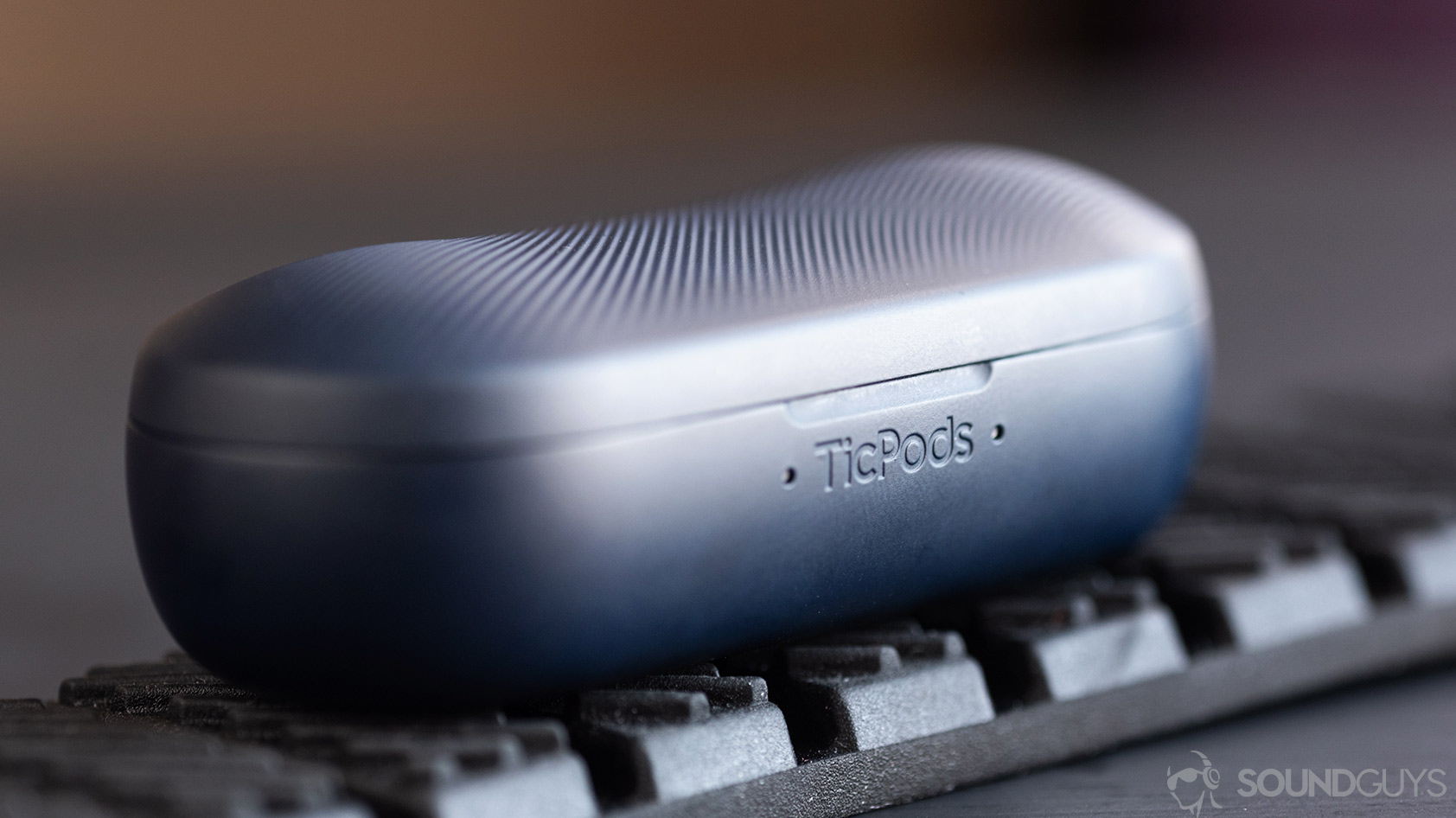 A macro picture of the Mobvoi TicPods 2 Pro true wireless earbuds charging case with the TicPods name in focus.