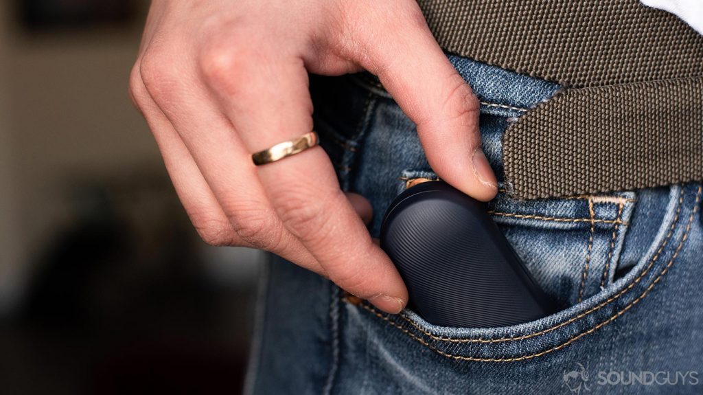 A picture of the Mobvoi TicPods 2 Pro true wireless earbuds charging case being removed from a pocket.