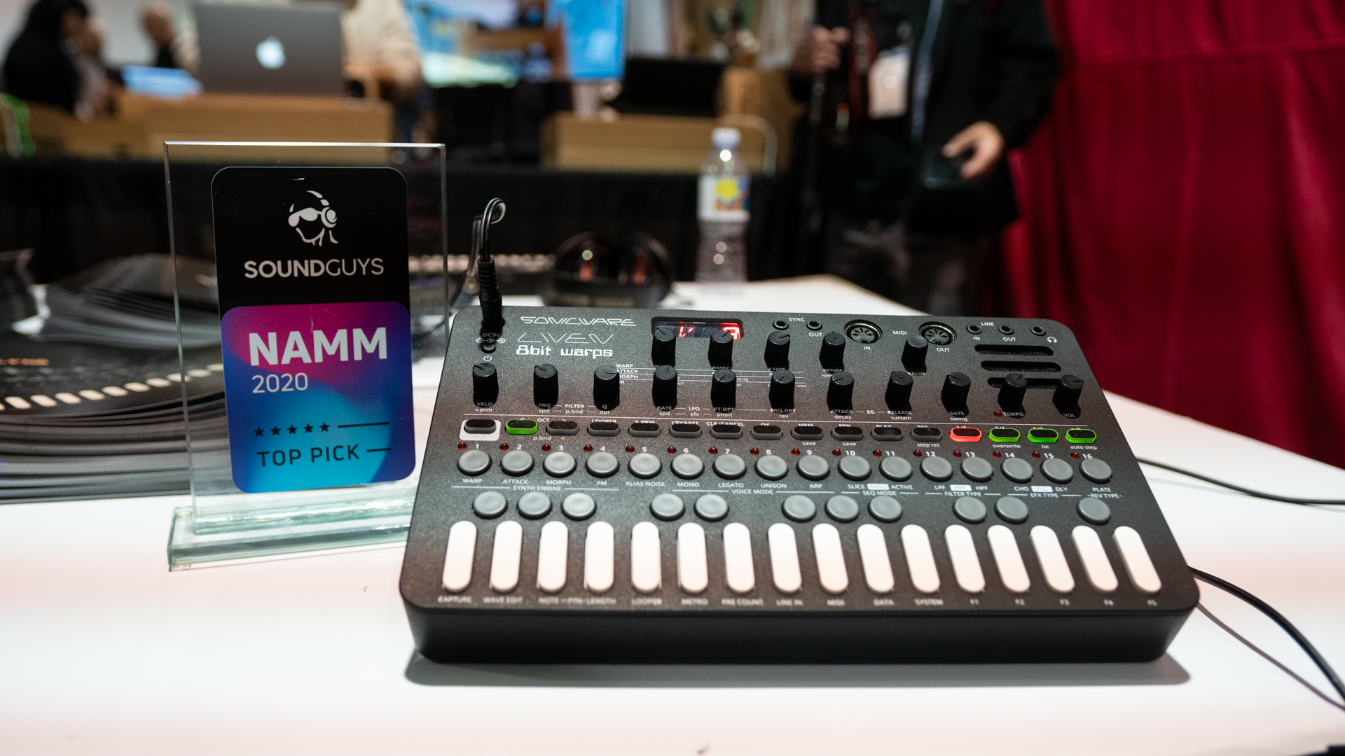 The Sonicware Liven 8bit warps synth pictured next to the SoundGuys award on a table at NAMM 2020. 