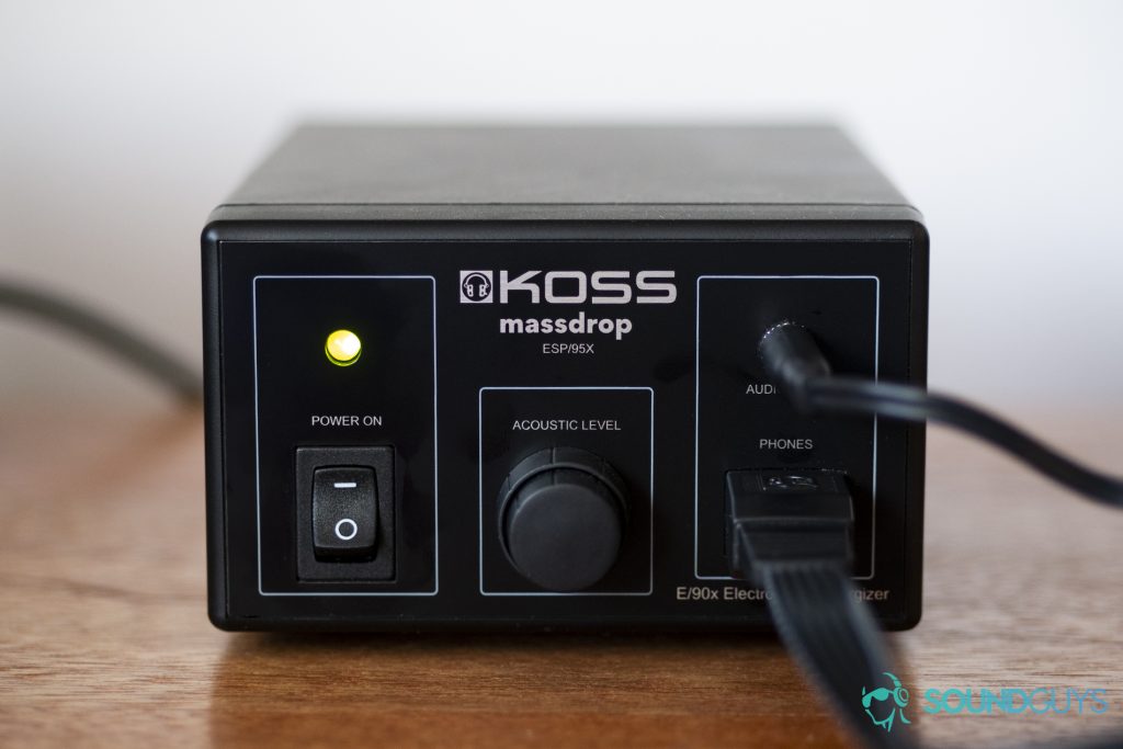 A photo of the obvserse of the Massdrop x Koss ESP/95X's E/90x Electrostatic Energizer on a wooden desk.