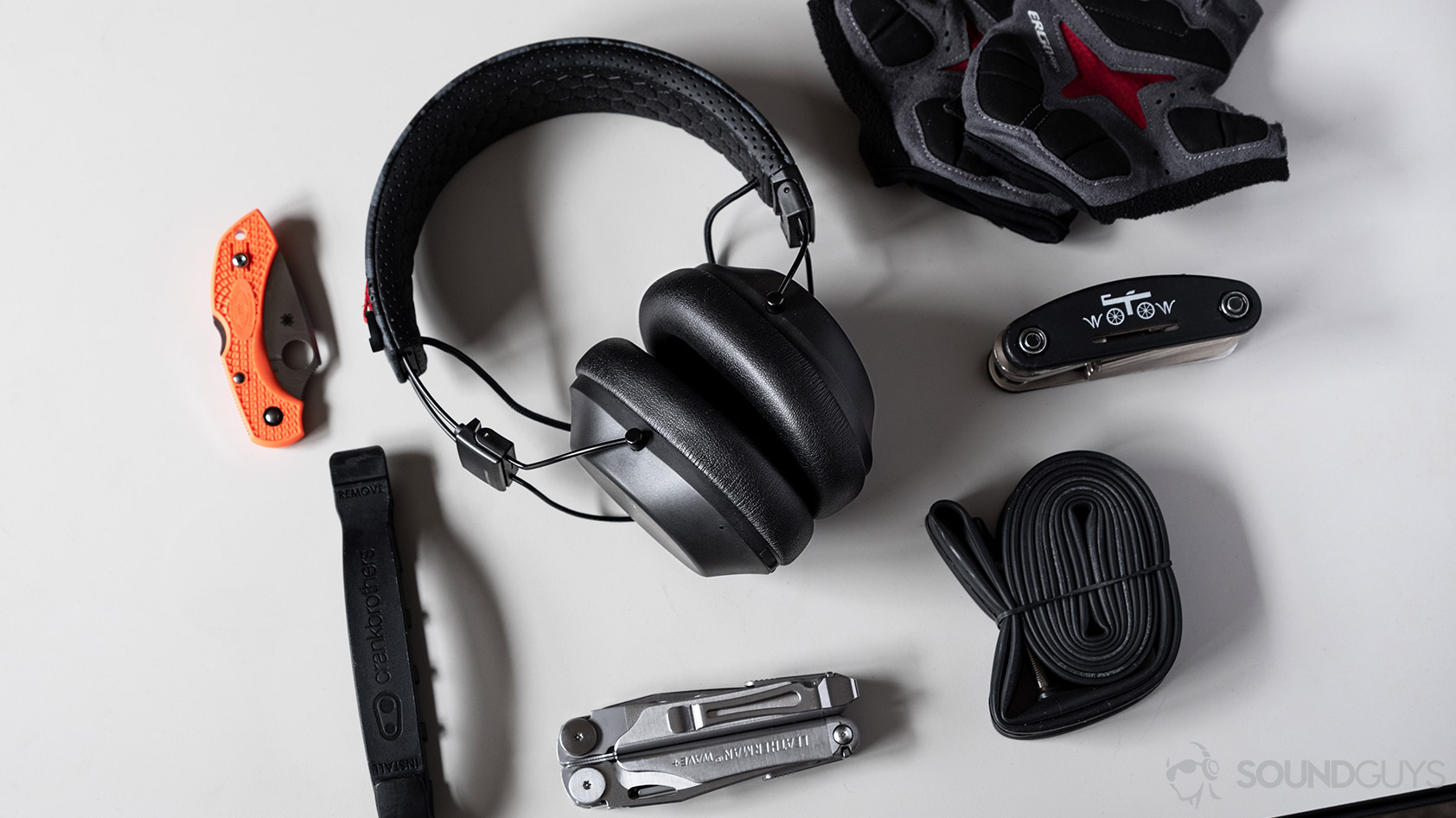 The Plantronics BackBeat Fit 6100 workout headphones next to biking gear.