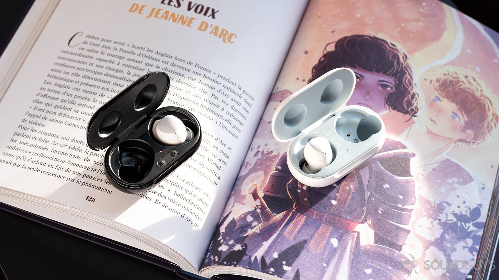 A picture of the Samsung Galaxy Buds Plus and Galaxy Buds with one earbud in each case atop an illustrated book.