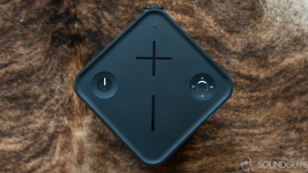 Pictured is a top-down shot of the UE Hyperboom against a cowskin rug. 