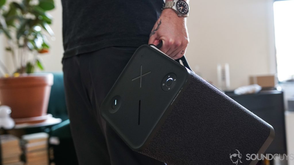 Man holding the UE Hyperboom via the handle. 