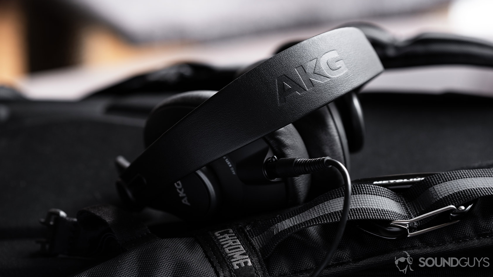 A picture of the AKG K371 wired over-ear headphones with the AKG headband in focus.