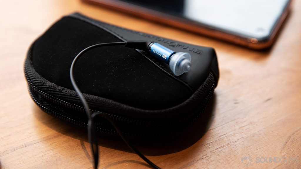 A picture of the Etymotic ER2SE wired earbuds with the triple-flange ear tip turned upward to illustrate how to install different tips.