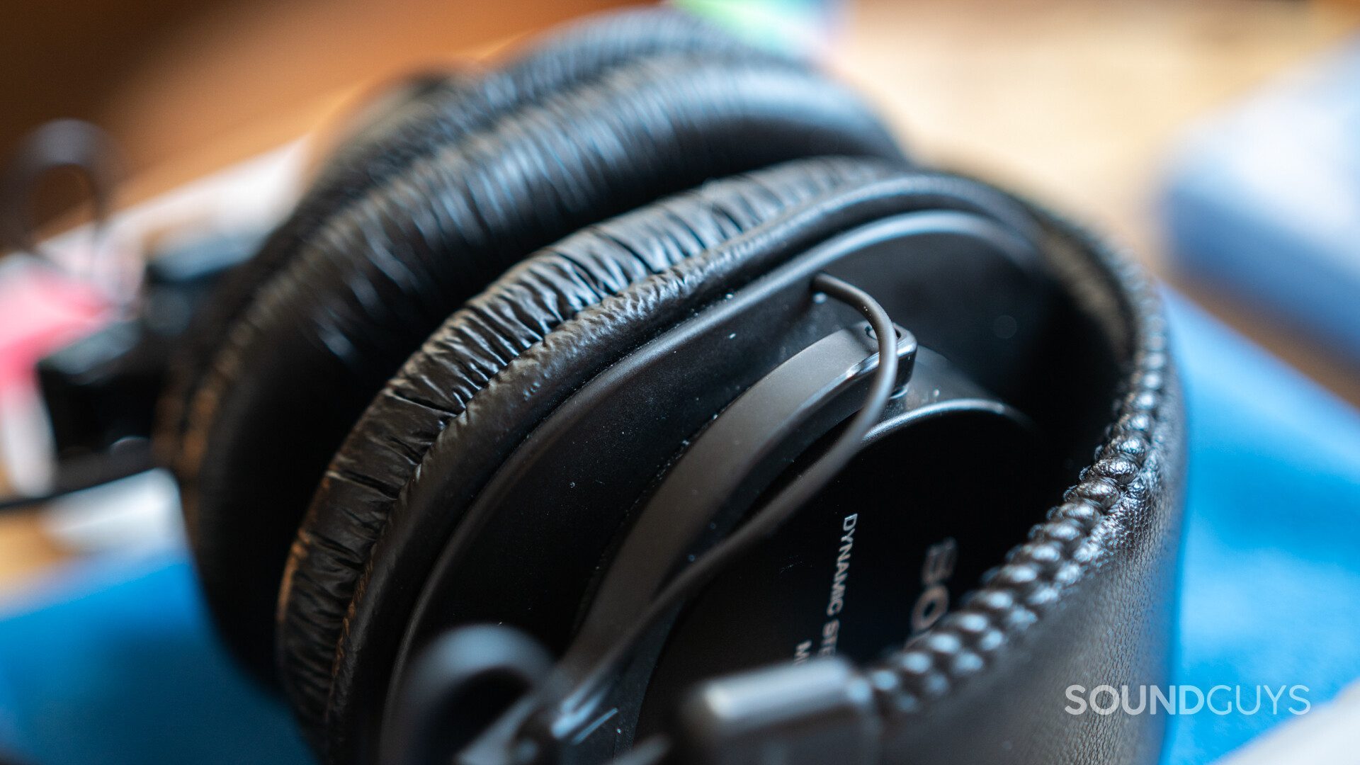 Close-up of Sony MDR-7506 headphones with specs of dust in it