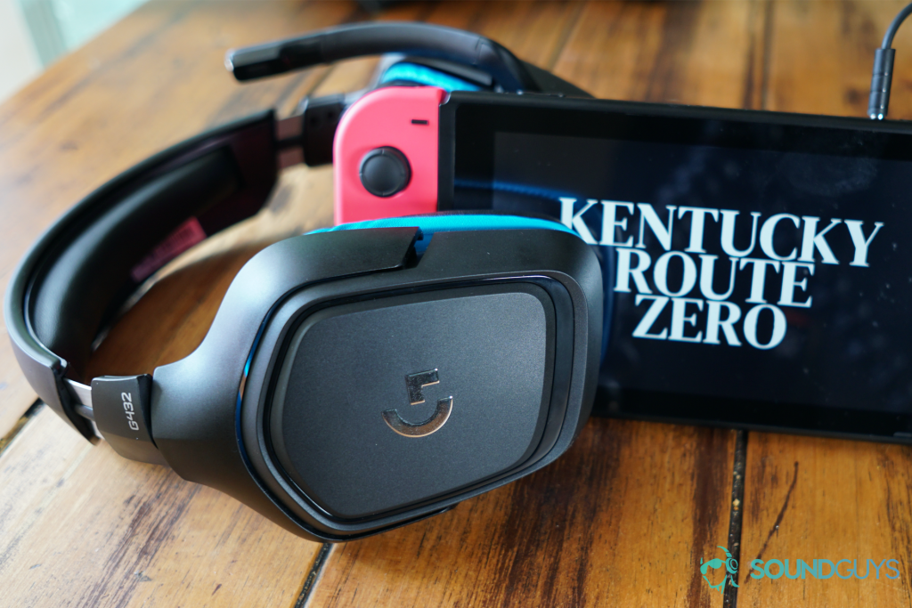 The Logitech G432 sits on a wooden table next to a Nintendo Switch running Kentucky Route Zero