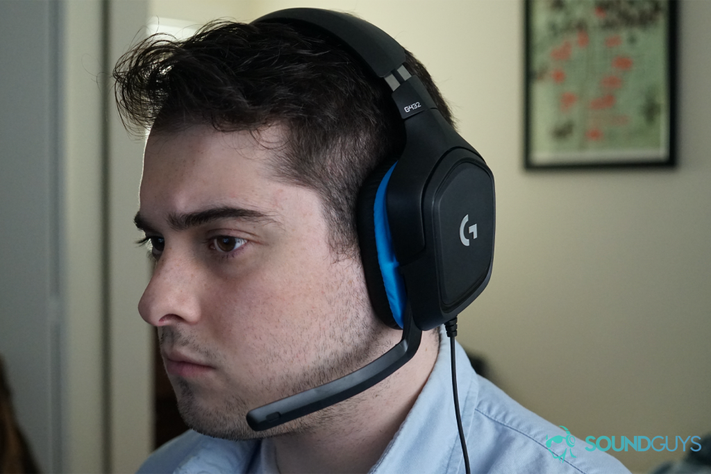 A man wears The Logitech G432 sitting at a computer