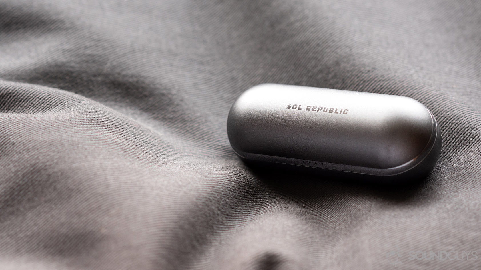 A photo of the Sol Republic Amps Air Plus true wireless noise canceling earbuds USB-C charging case.