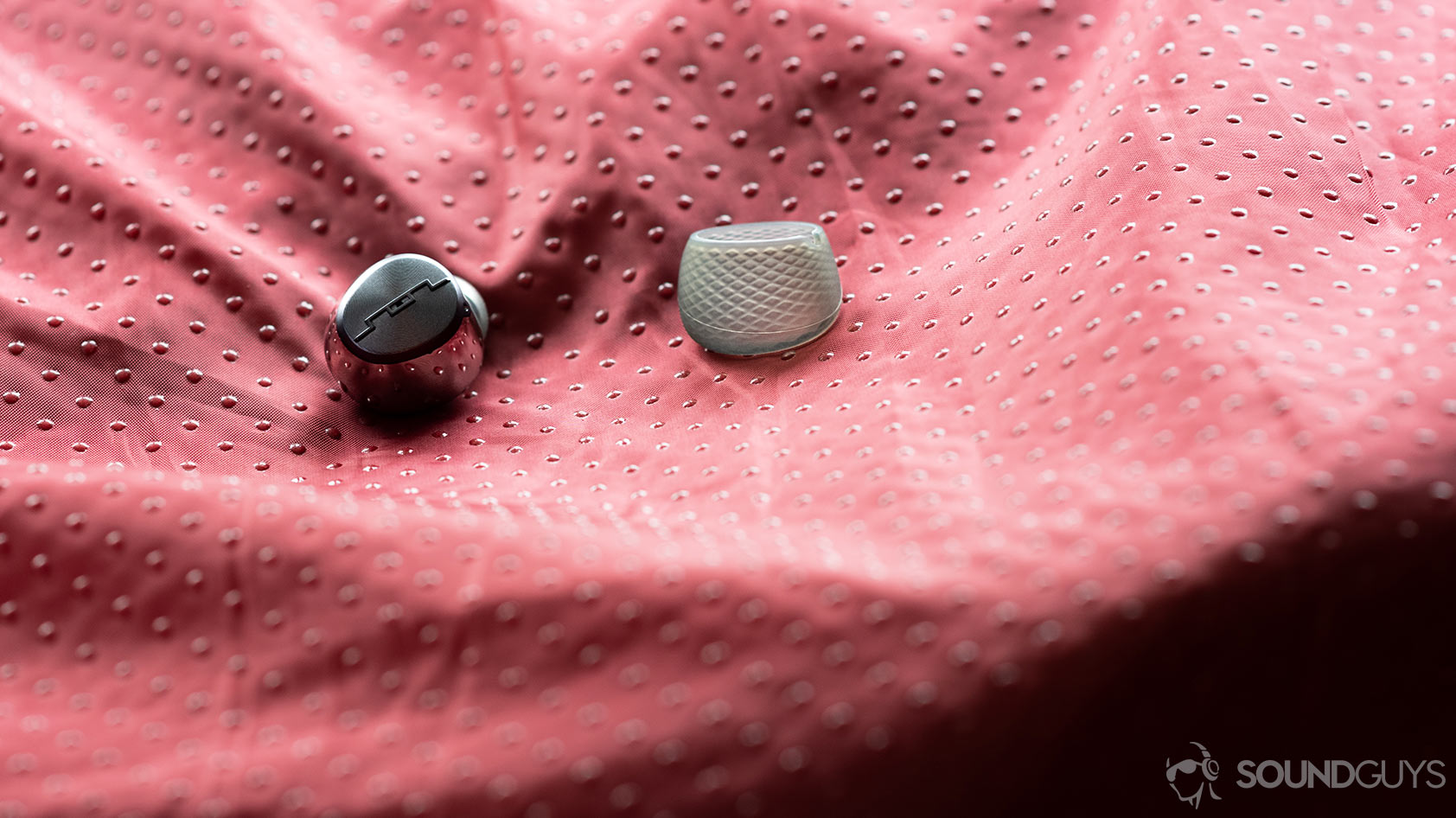 A photo of the Sol Republic Amps Air Plus true wireless noise canceling earbud with the silicone sleeve removed from the housing.