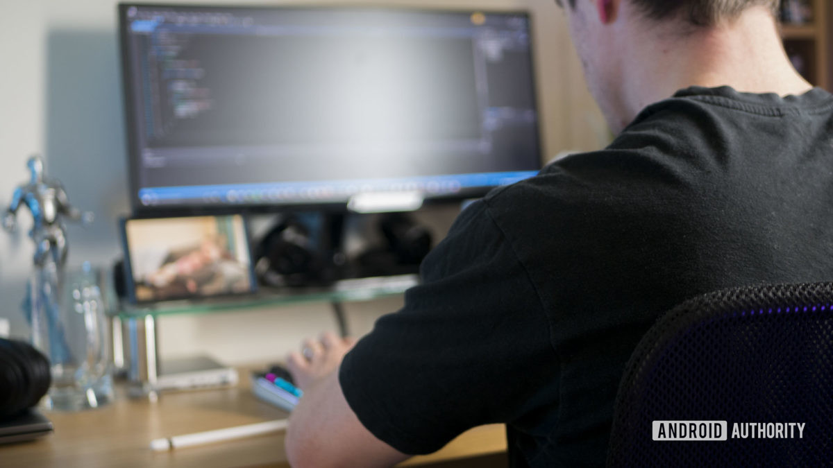 A man sitting at a desk learning how to work from home.