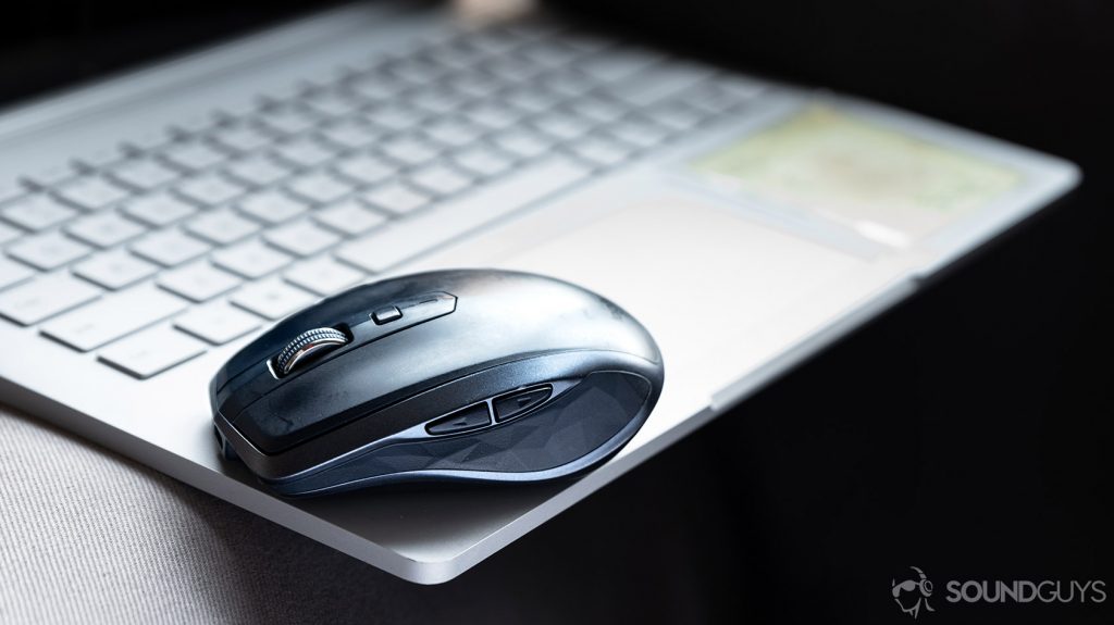 How to work from home with a Logitech MX Anywhere mouse placed atop a laptop.