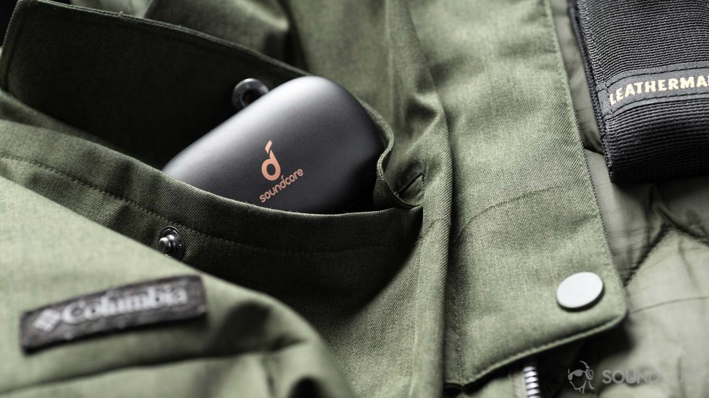 A picture of the Anker Soundcore Life P2 true wireless earbuds charging case in a coat pocket.