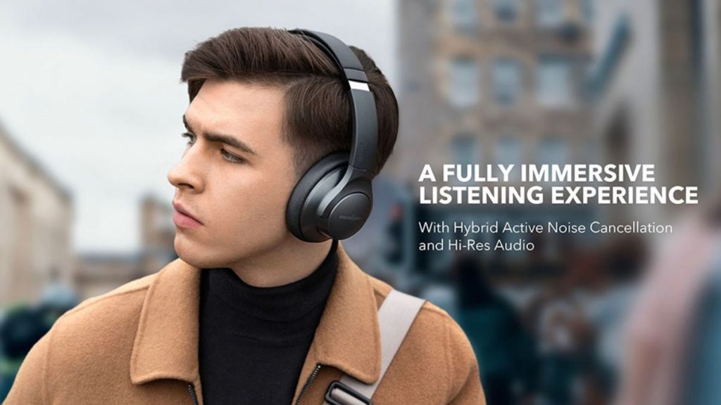 A lifestyle product image of a man wearing the Anker Soundcore Life Q20 cheap noise cancelling headphones while looking to the left side of the frame; these would be one of the best headphones under $100 if they were easier to find.