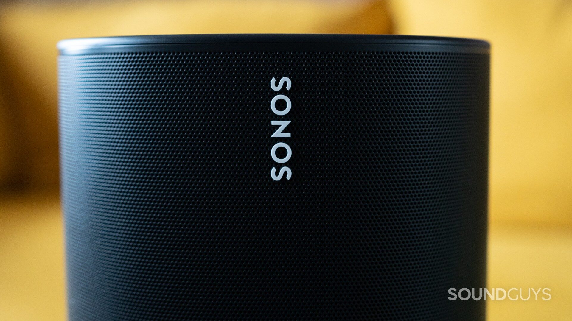 Close-up of the white Sonos logo on the black speaker
