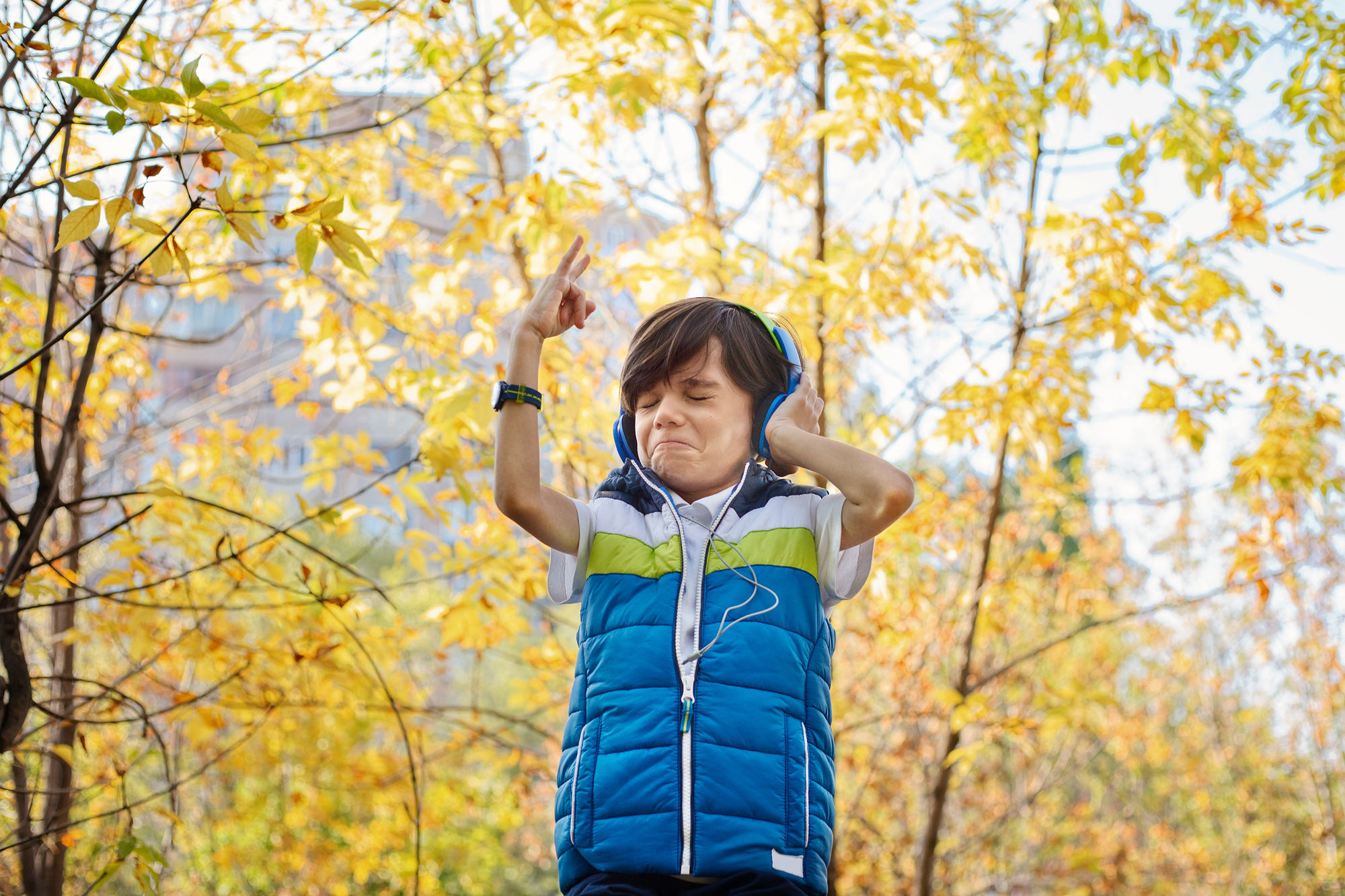 A photo of a child listening to headphones, used for illustrative effect when addressing how to find new music.