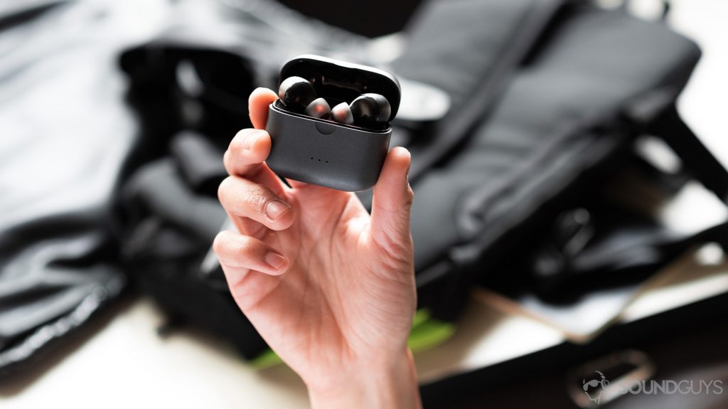 A photo of the Anker SoundCore Liberty Air 2 true wireless earbuds in the open case, which is held on display in a woman's hand.