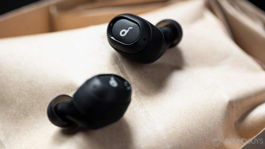 A picture of the Anker SoundCore Liberty Neo true wireless earbuds atop a brown paper bag.