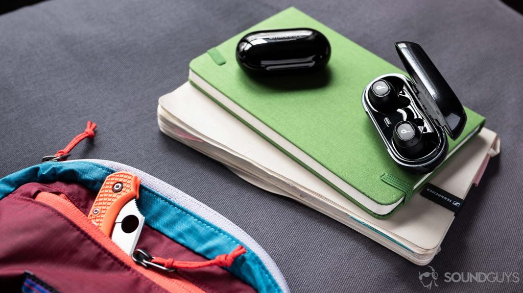 A picture of the Anker SoundCore Liberty Neo true wireless earbuds' charging case open and next to the Samsung Galaxy Buds Plus case for size reference.