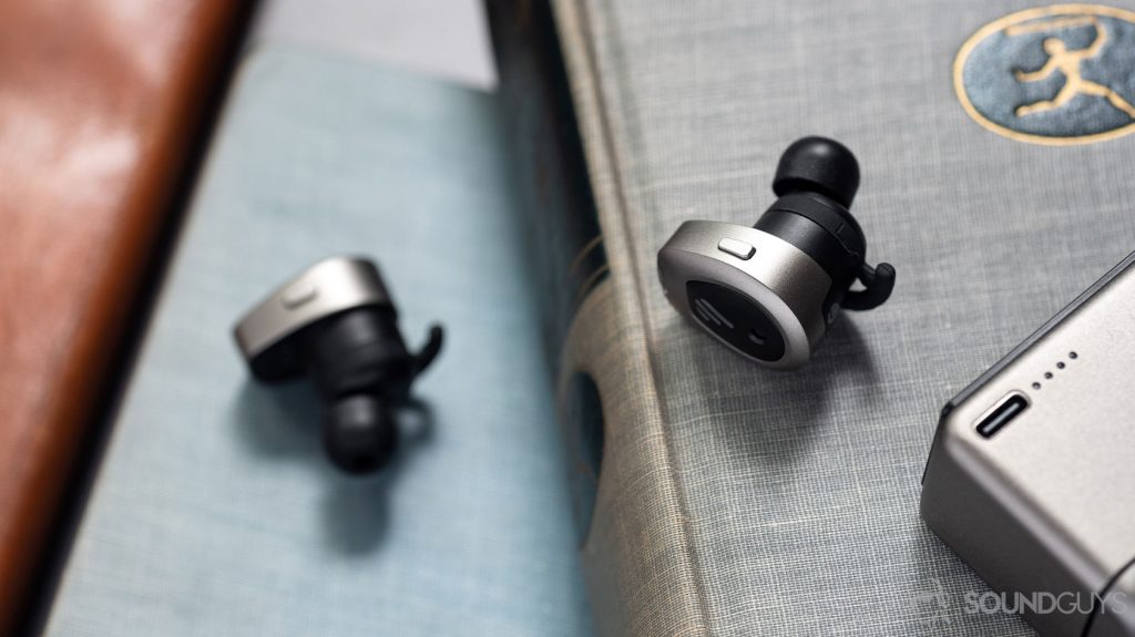 A picture of the Edifier TWS NB true wireless noise canceling earbuds onboard controls with the USB-C input on the charging case visible in the bottom-right corner.