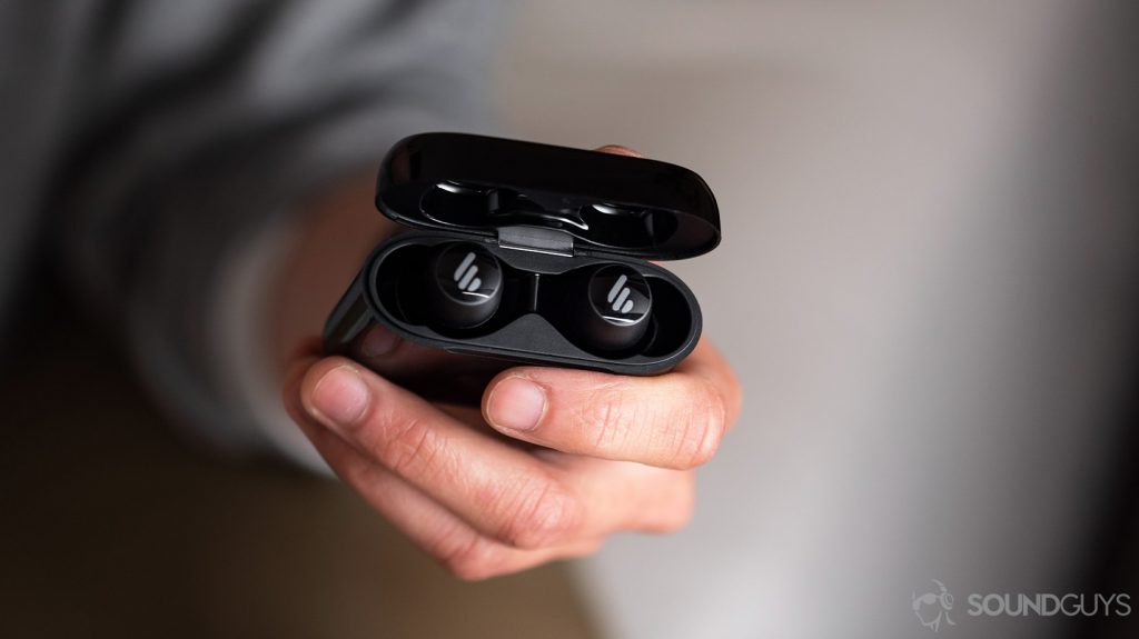 A picture of the Edifier TWS6 cheap true wireless earbuds under $100 charging case open and held in a woman's hand.