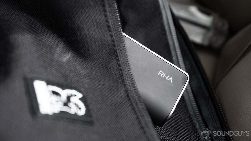 RHA TrueConnect 2 true wireless charging case peaking out from a bag's pocket.