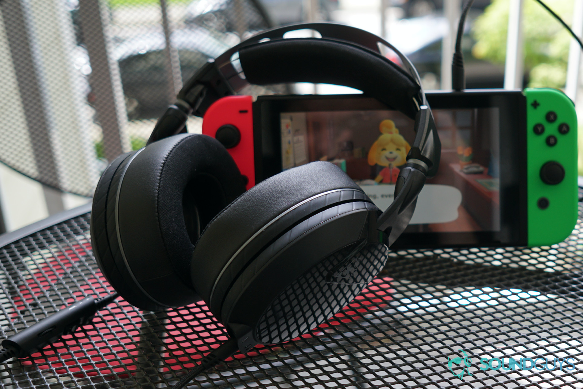 The Turtle Beach Elite Atlas gaming headset leans on a Nintendo Switch running Animal Crossing: New Horizons.