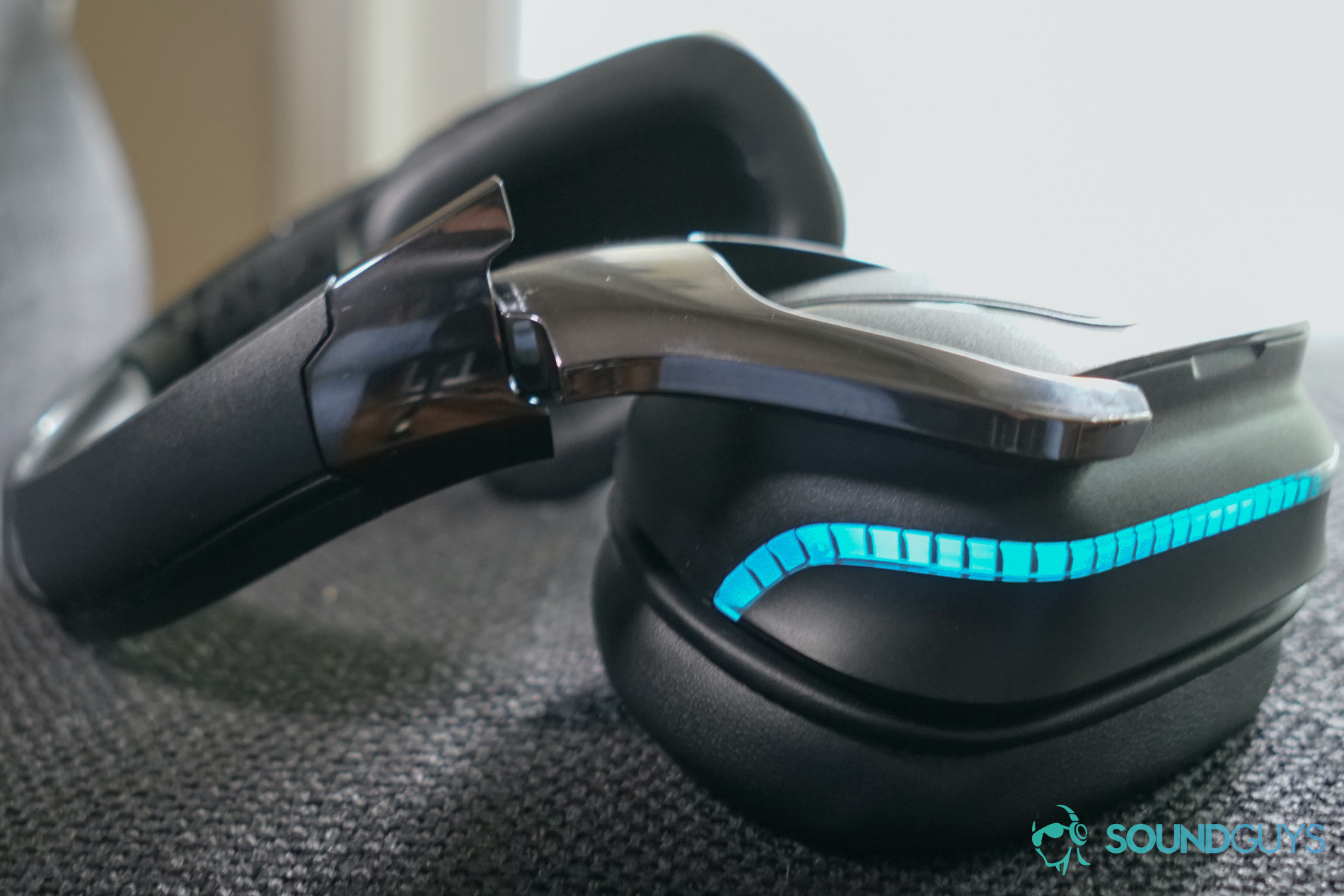The Logitech G935 gaming headset lays on a fabric surface.