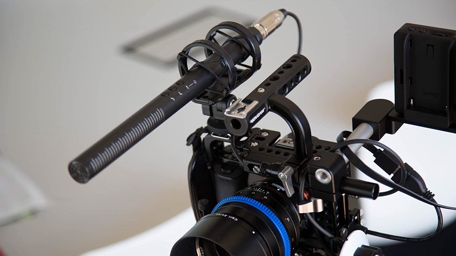 A picture of the Rode NTG4+ mounted on top of a camera.