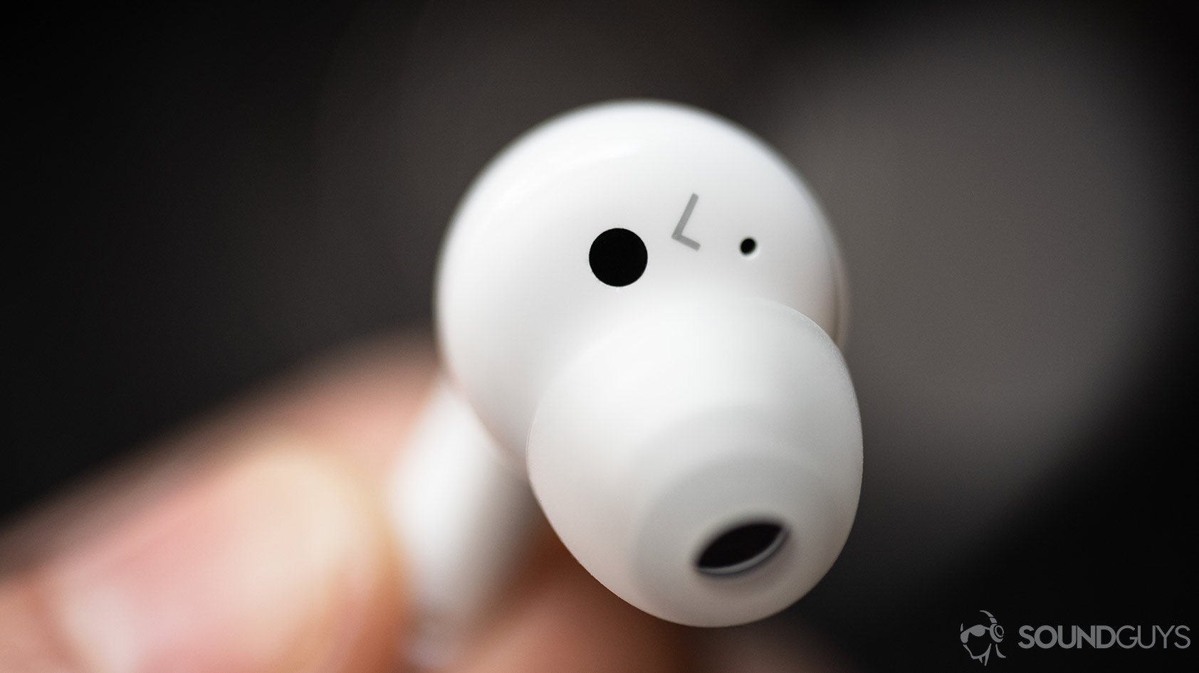 A macro photo of an LG TONE Free HBS-FN6-6 true wireless earbud's automatic ear-detecting sensor.