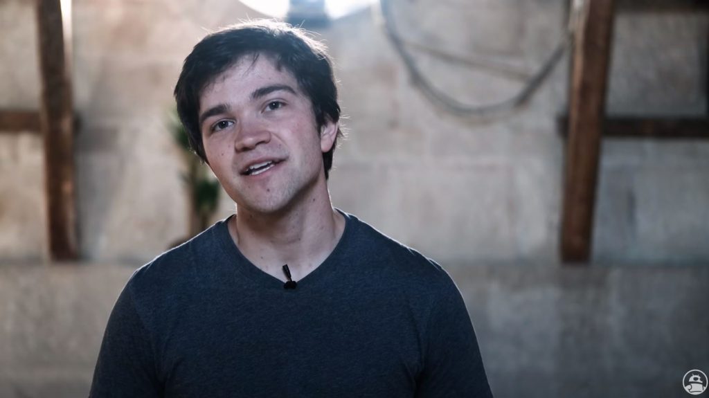 A picture of a man wearing a lavalier microphone.