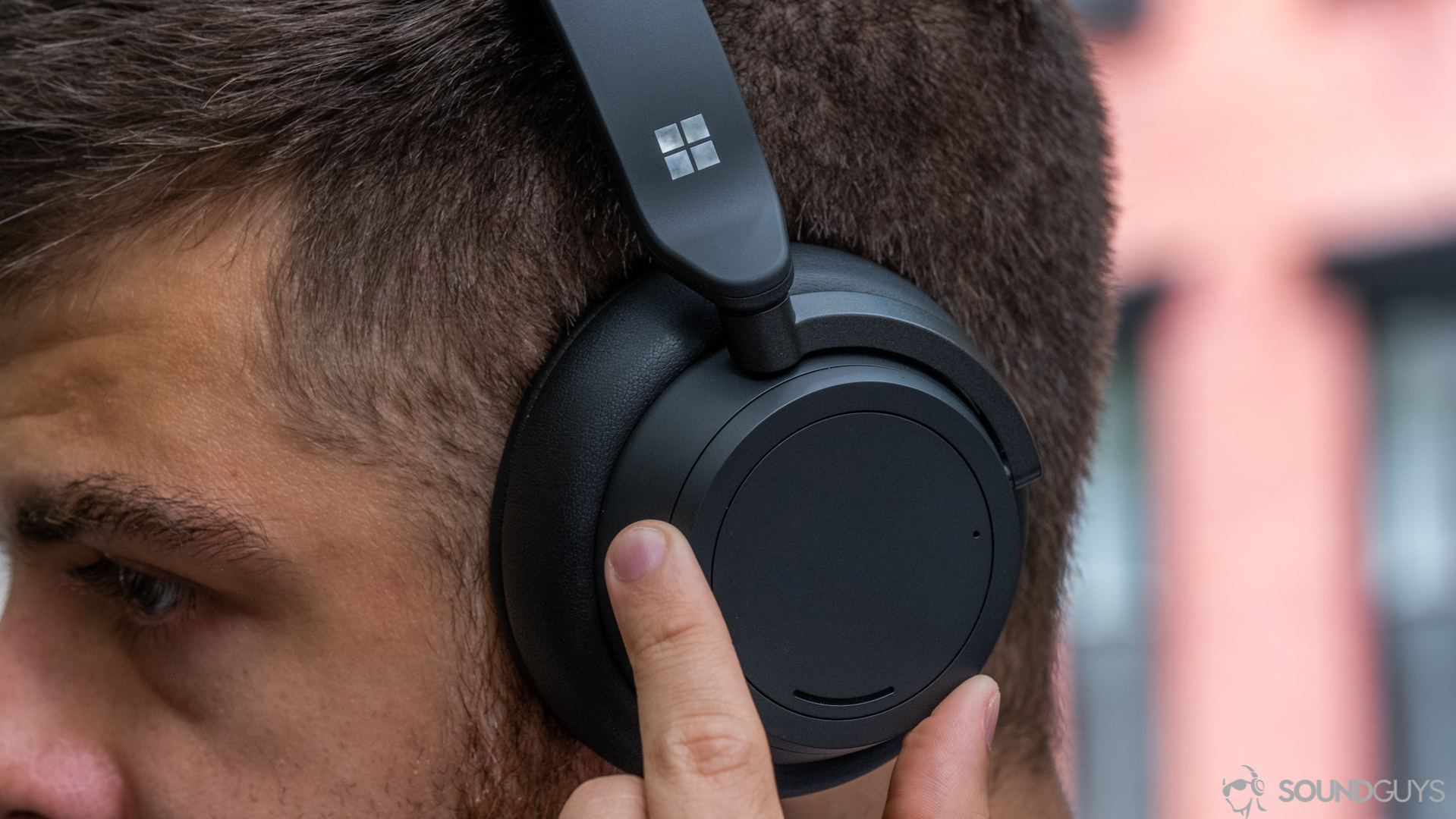 Man moving the ring on the Microsoft Surface Headphones 2