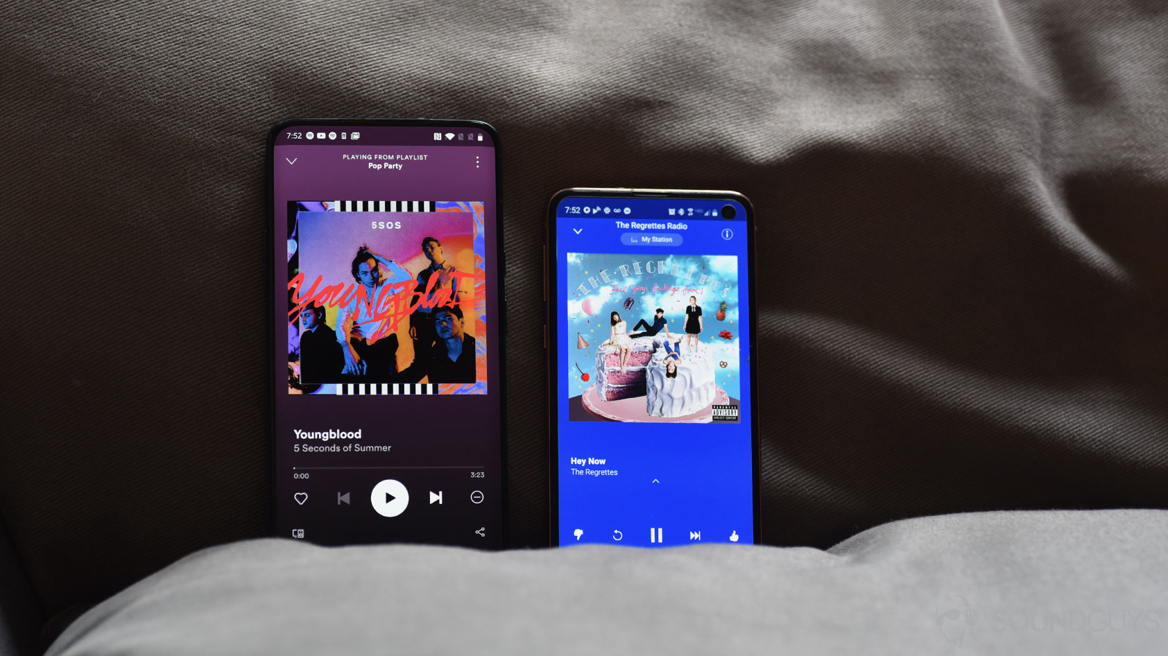 A picture of Pandora vs Spotify music streaming services playing now function on smartphones next to one another.