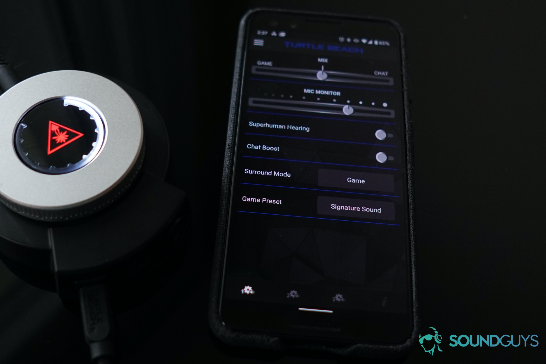 The Turtle Beach Elite Pro 2 gaming headset SuperAmp sits next to a Google Pixel 3 running the Turtle Beach Android app.