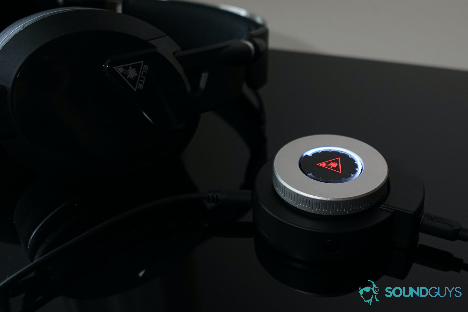 Turtle Beach Elite Pro 2 super amp shot The Turtle Beach Elite Pro 2 gaming headset sits with its SuperAmp on a black reflective surface