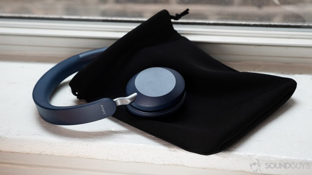 A picture of the Jabra Elite 45h on-ear Bluetooth headphones halfway inside the included neoprene carrying case that's resting on a windowsill.