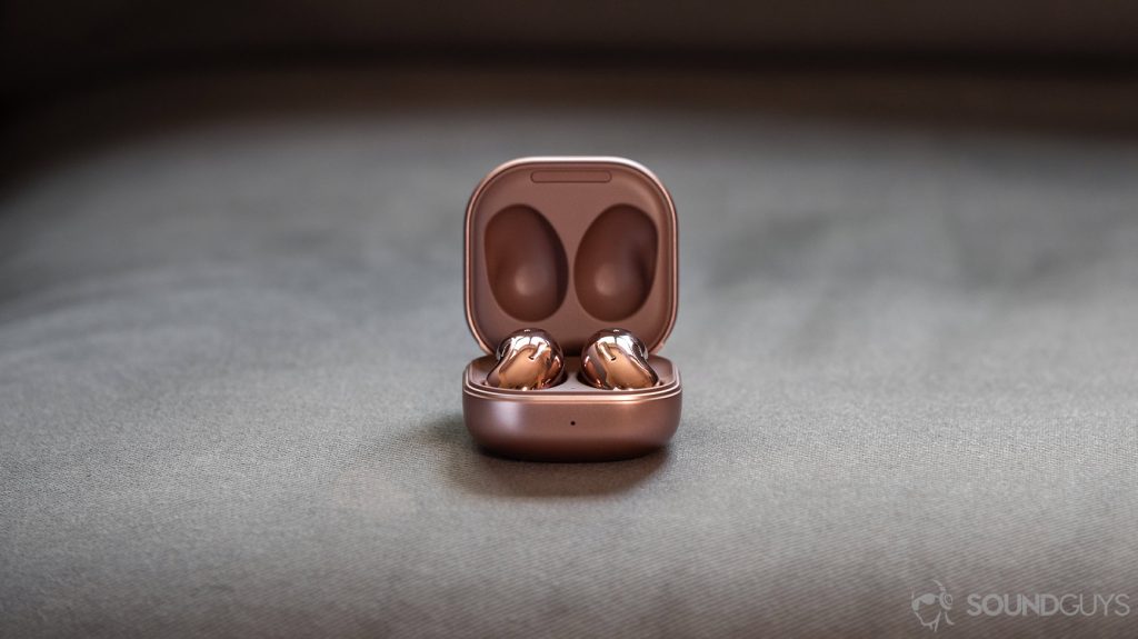A picture of the Samsung Galaxy Buds Live noise cancelling true wireless earbuds in the case against a gray background for a comparison in the Apple AirPods vs Samsung Galaxy Buds Live breakdown.
