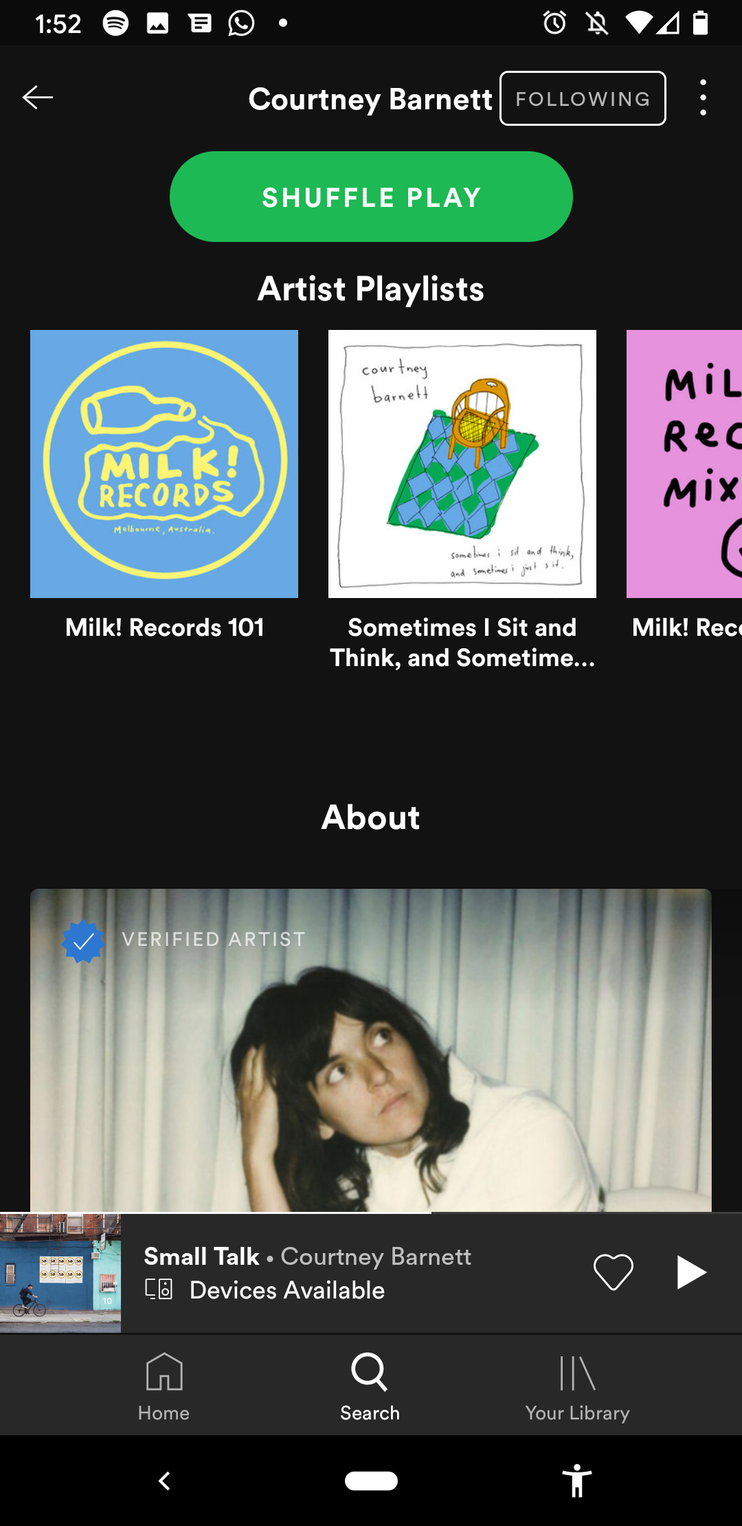 Screenshot of an artist profile on Spotify displaying Artist Playlists and the beginning of the About section
