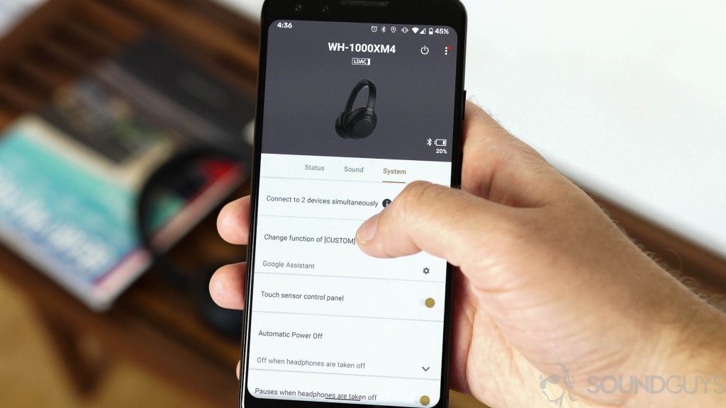 A man uses a Pixel 3 with the Sony Headphones app open.